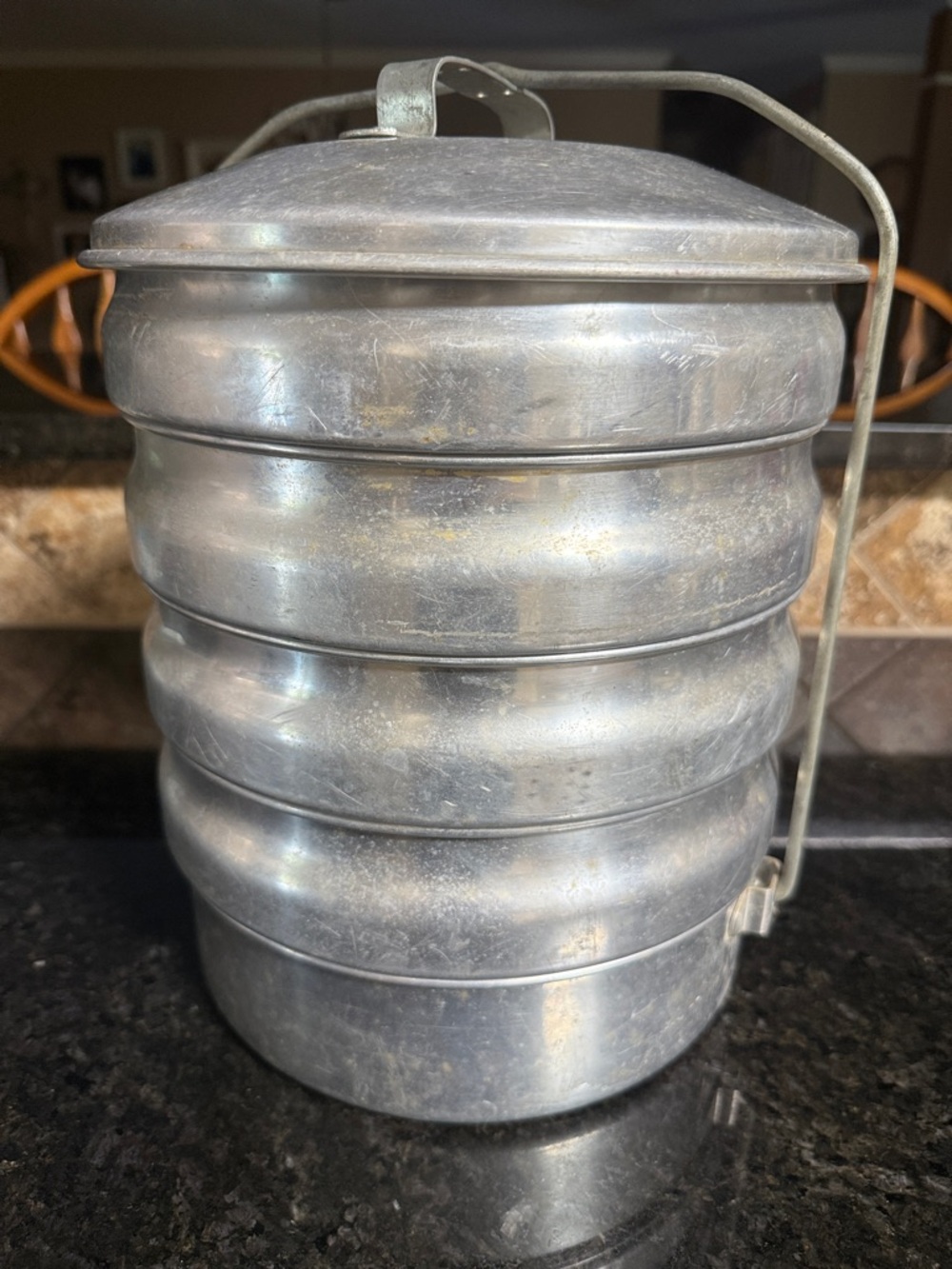 This vintage item is a Regal Aluminum Picnic Carrier.